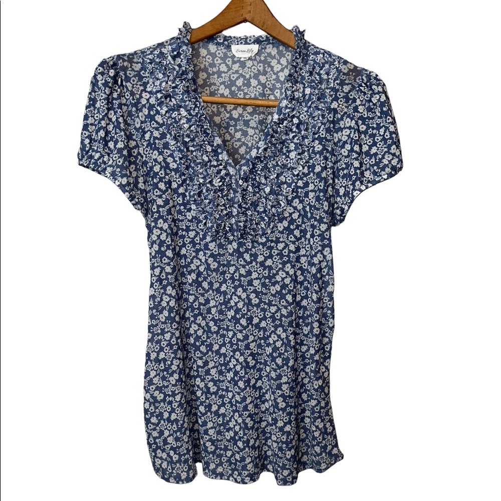 Light and airy blouse with bubble sleeves. Ruffled front bodice.